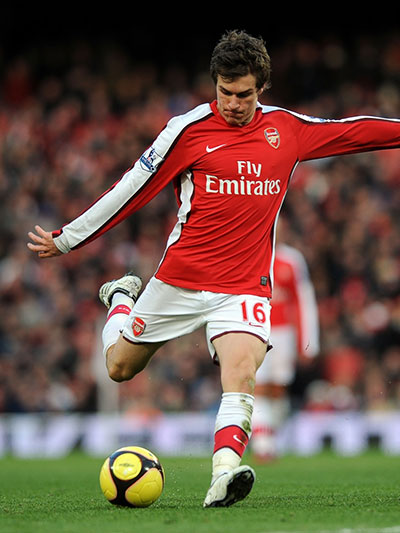 Aaron Ramsey of Arsenal kicking a football