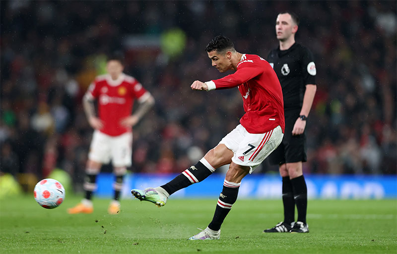 Cristiano Ronaldo taking a free kick. He usually uses the knuckleball technique.