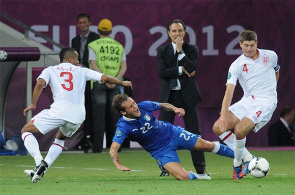 Alessandro Diamanti (22) slide tackles Steven Gerrard (4) at Euro 2012