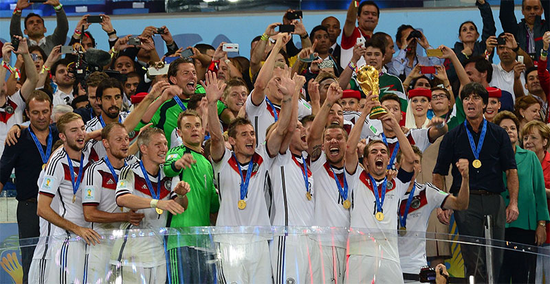 Germany captain Philipp Lahm lifts the World Cup trophy.